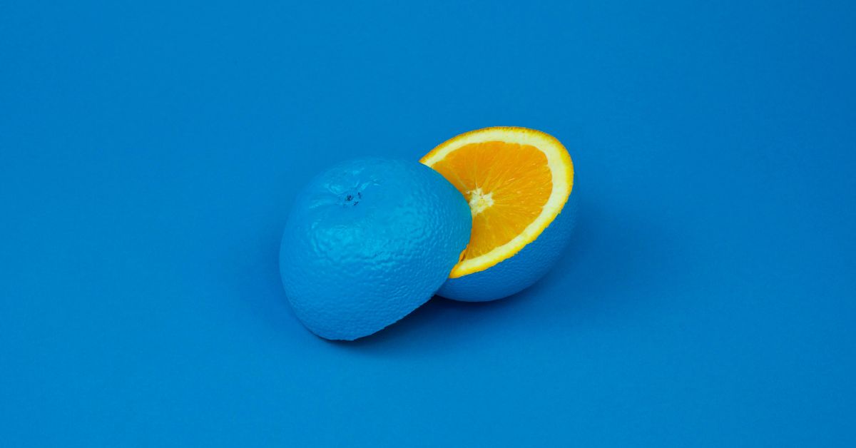 picture of an orange painted blue sliced
